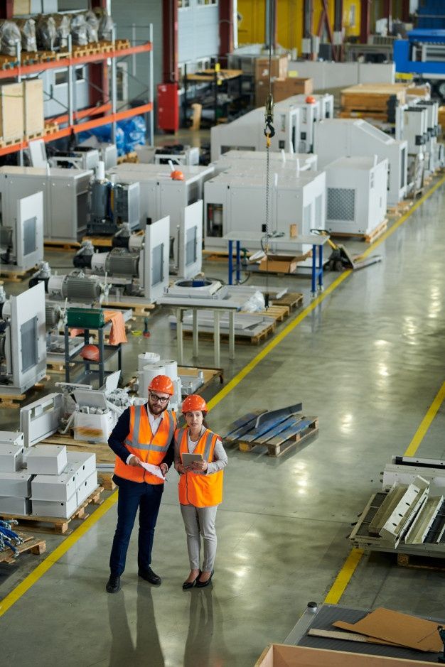 Premium Photo _ Foreman Inspecting Production